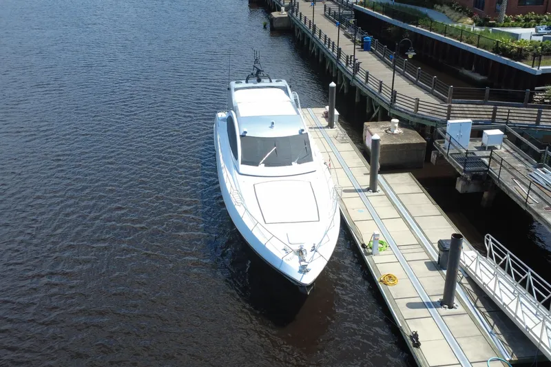 Slide: The Image of Luxury 2010 Mangusta 72 Express yacht docked at a marina. - 5