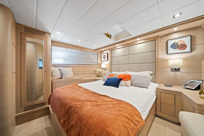 Slide: The Image of Luxurious bedroom interior of 2010 Mangusta 72 Express yacht with modern decor and cozy bedding. - 50