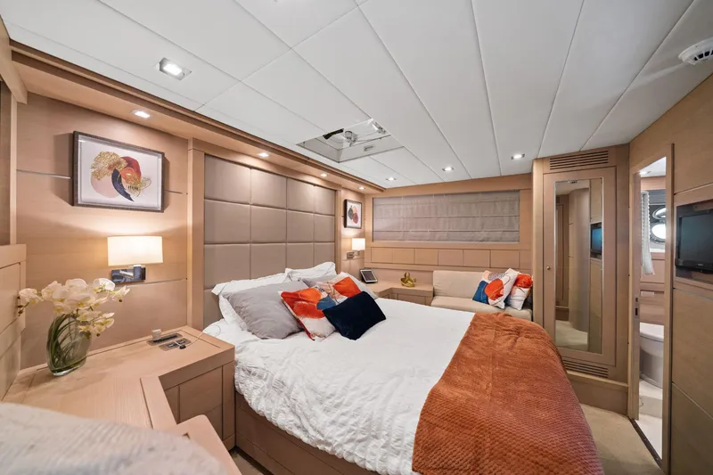 Slide: The Image of Luxurious bedroom interior of 2010 Mangusta 72 Express yacht with modern decor and cozy bedding. - 53