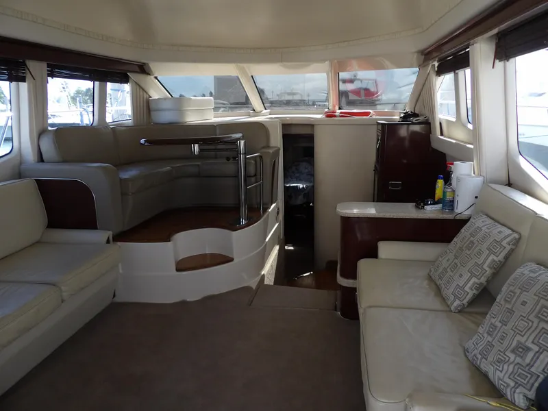 Slide: The Image of Luxurious interior of 2008 Sea Ray 44 Sedan Bridge yacht with plush seating. - 12