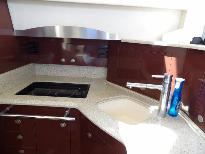 Slide: The Image of Luxurious kitchen area in 2008 Sea Ray 44 Sedan Bridge yacht with modern amenities. - 29