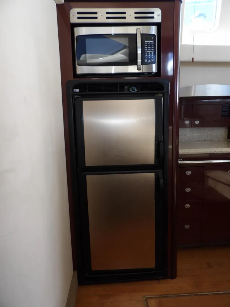Slide: The Image of Microwave and fridge in 2008 Sea Ray 44 Sedan Bridge yacht kitchen. - 31