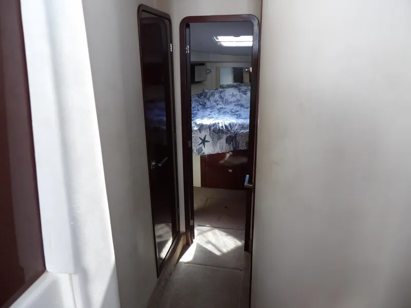 Slide: The Image of Interior hallway of 2008 Sea Ray 44 Sedan Bridge yacht, leading to a bedroom. - 34
