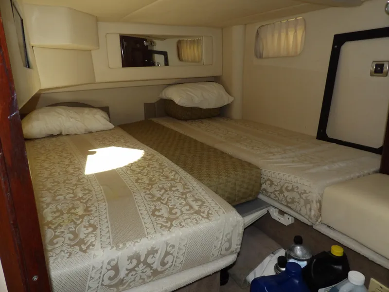 Slide: The Image of 2008 Sea Ray 44 Sedan Bridge cabin with twin beds and elegant bedding. - 37
