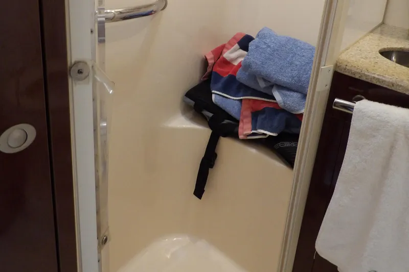 Slide: The Image of Shower area in 2008 Sea Ray 44 Sedan Bridge with clothes and towels. - 44