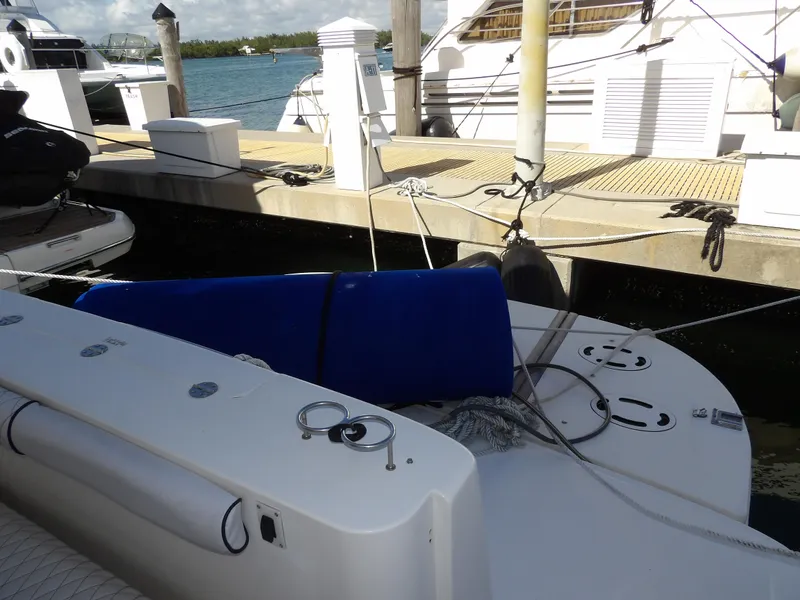 Slide: The Image of 2008 Sea Ray 44 Sedan Bridge docked at marina with blue fender. - 5