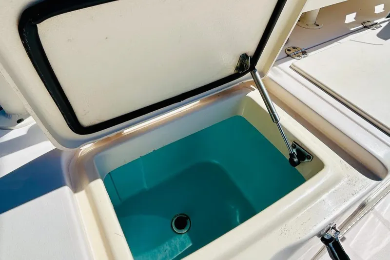 Slide: The Image of 2012 Grady-White Canyon 366 livewell compartment with open lid. - 15