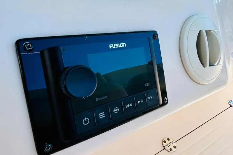 Slide: The Image of Fusion audio system on 2012 Grady-White Canyon 366 boat dashboard. - 27