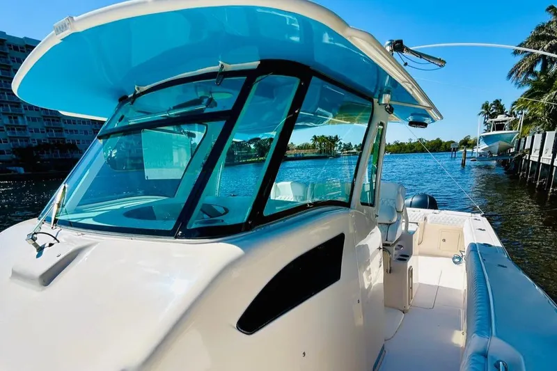 Slide: The Image of 2012 Grady-White Canyon 366 boat on a sunny waterfront. - 30