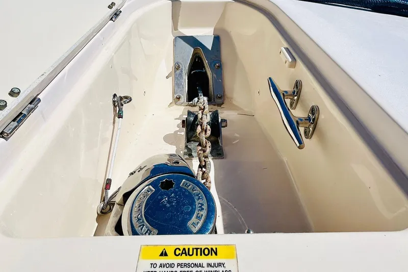 Slide: The Image of Anchor compartment of 2012 Grady-White Canyon 366 boat with caution label. - 39