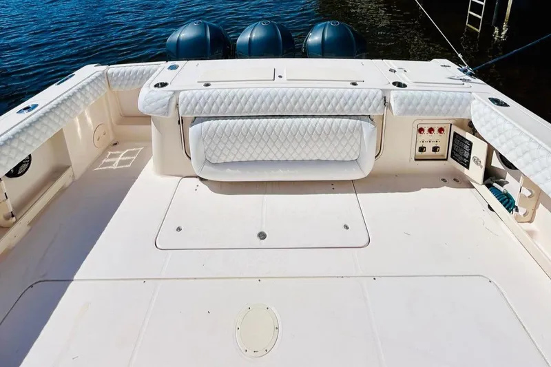 Slide: The Image of 2012 Grady-White Canyon 366 boat deck with triple outboard engines. - 7