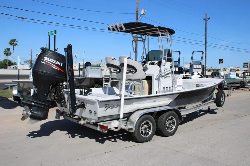 The Image of 2015 Shoalwater 20 Catamaran with Suzuki outboard motor on trailer. - 1