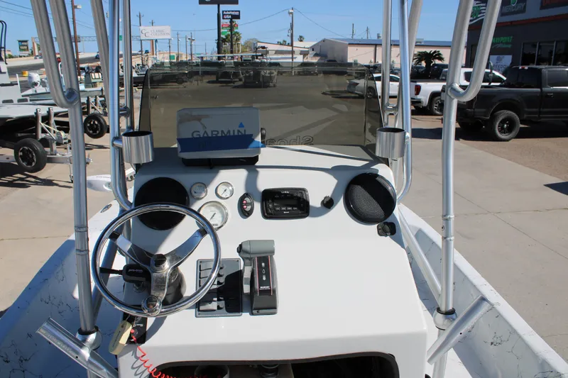 Slide: The Image of 2015 Shoalwater 20 Catamaran dashboard with steering wheel and Garmin GPS. - 12