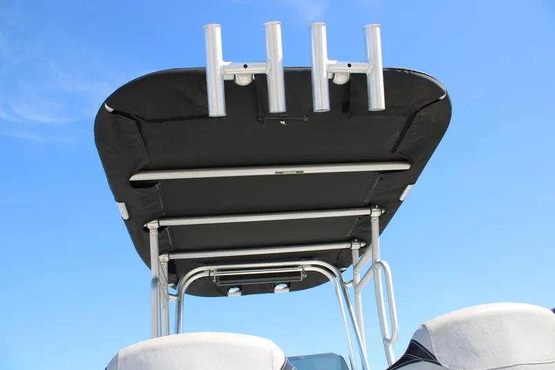 Slide: The Image of 2015 Shoalwater 20 Catamaran T-top with rod holders against blue sky. - 14