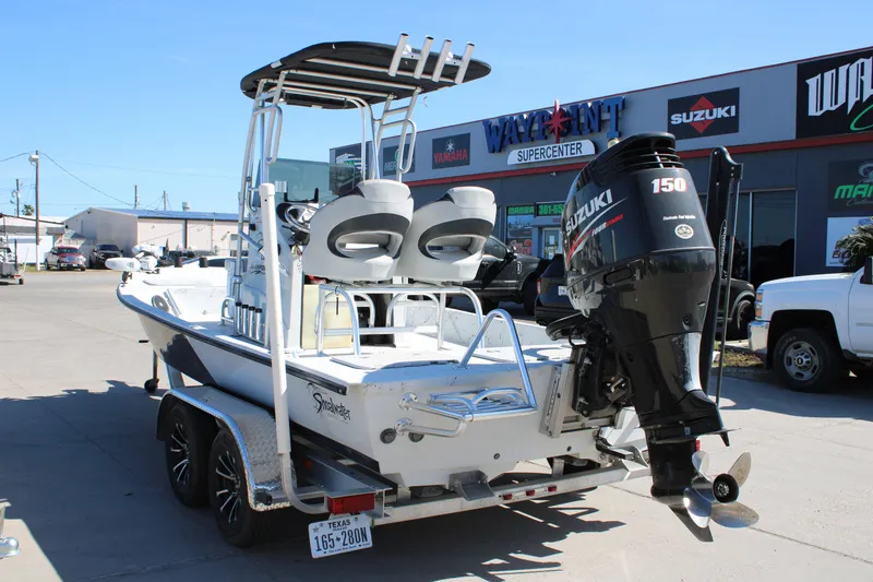 Slide: The Image of 2015 Shoalwater 20 Catamaran with Suzuki 150 engine at dealership. - 3