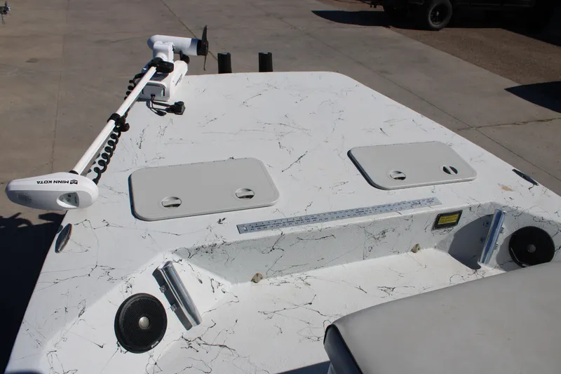 Slide: The Image of 2015 Shoalwater 20 Catamaran deck with Minn Kota trolling motor and storage hatches. - 6