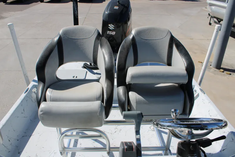 Slide: The Image of 2015 Shoalwater 20 Catamaran interior with dual seats and steering console. - 9