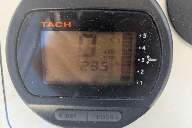 Slide: The Image of Tachometer display on 2012 Key West 216 Bay Reef boat showing 235 hours. - 11