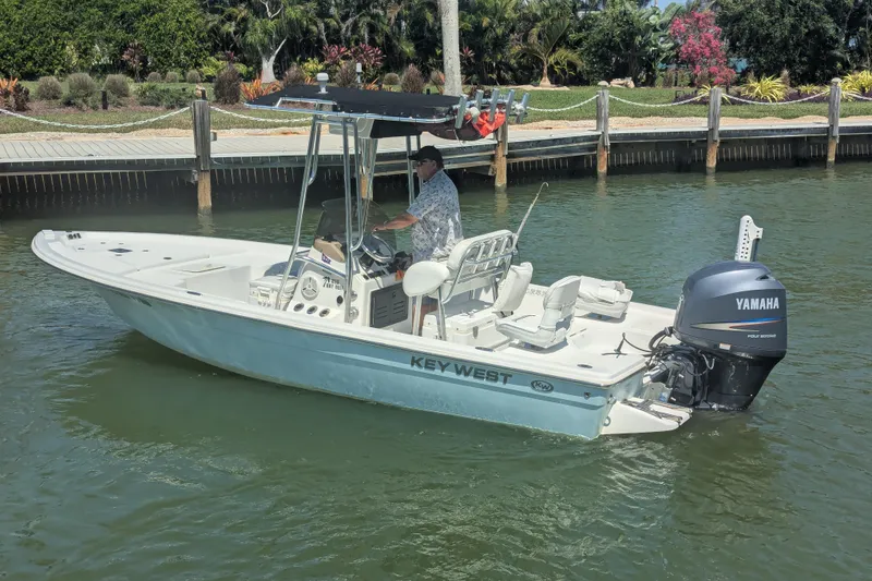Slide: The Image of 2012 Key West 216 Bay Reef boat with Yamaha engine on calm water. - 3