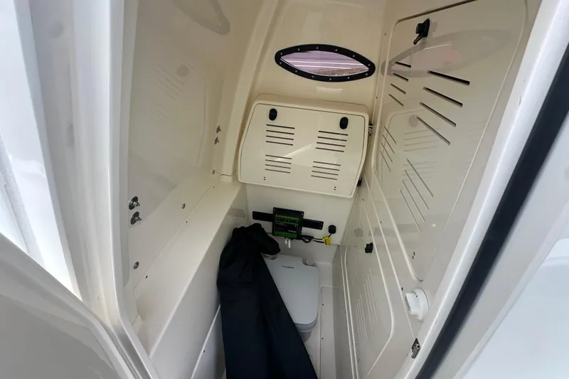 Slide: The Image of Interior cabin of 2026 ShearWater 260 SS Carolina boat, featuring compact design and storage. - 11