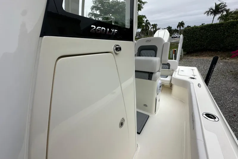 Slide: The Image of 2026 ShearWater 260 SS Carolina boat interior with seating and storage compartments. - 12
