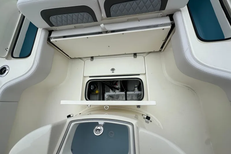 Slide: The Image of Interior view of 2026 ShearWater 260 SS Carolina boat, showcasing storage compartments. - 13