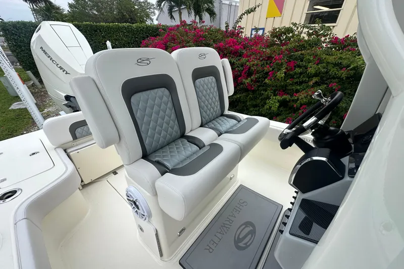 Slide: The Image of Luxury seating and helm of 2026 ShearWater 260 SS Carolina boat, featuring elegant design. - 21