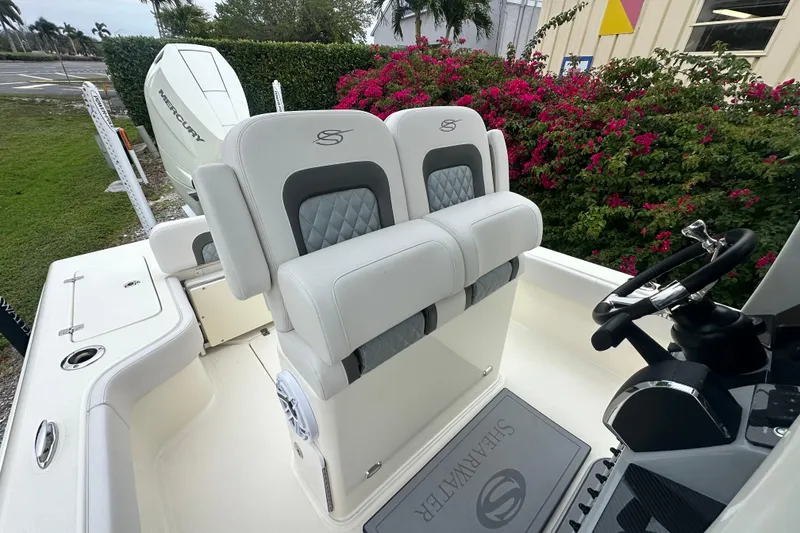 Slide: The Image of 2026 ShearWater 260 SS Carolina boat interior with dual seats and Mercury engine. - 22
