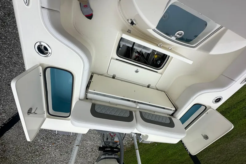 Slide: The Image of 2026 ShearWater 260 SS Carolina boat interior with storage compartments and seating. - 23