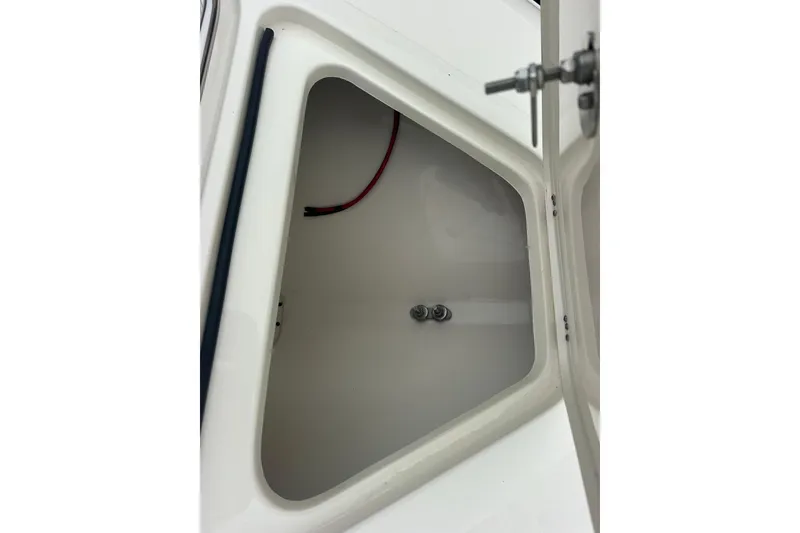 Slide: The Image of Open storage compartment on 2026 ShearWater 260 SS Carolina boat. - 29