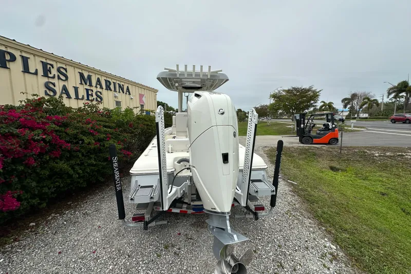 Slide: The Image of 2026 ShearWater 260 SS Carolina boat at marina sales lot, rear view. - 4