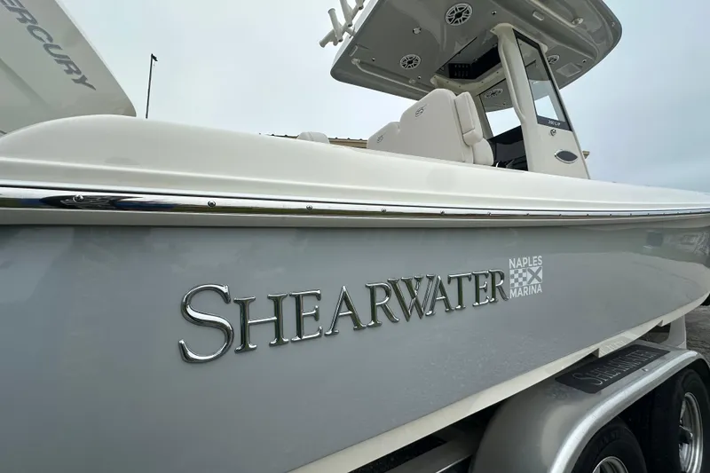 Slide: The Image of 2026 ShearWater 260 SS Carolina boat at Naples Marina, side view. - 5