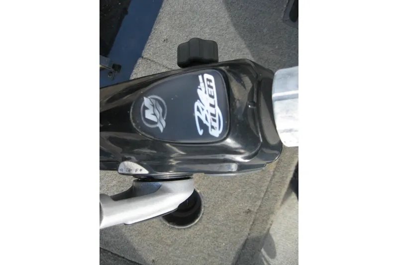 Slide: The Image of Close-up of 2015 Lund 1650 Rebel XL Tiller control handle on boat deck. - 10