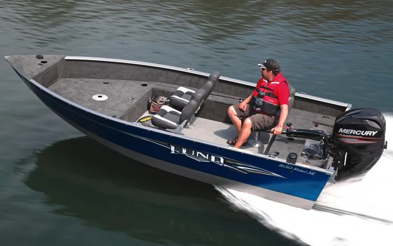 Slide: The Image of Manufacturer Provided Image: 2015 Lund 1650 Rebel XL Tiller boat in motion on water. - 18