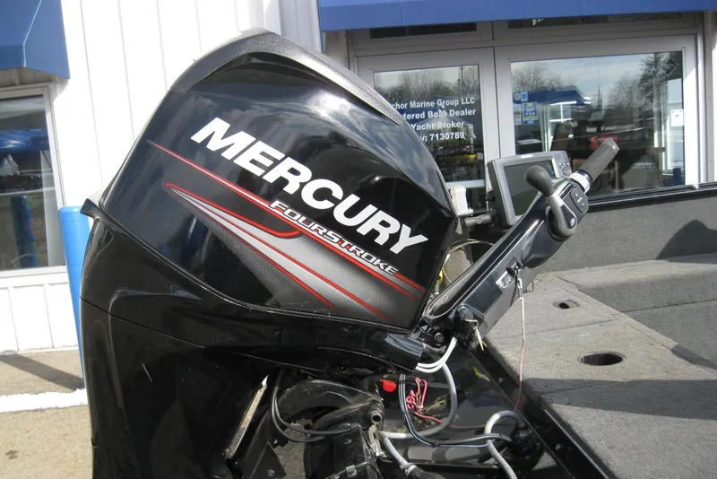 Slide: The Image of 2015 Lund 1650 Rebel XL Tiller with Mercury FourStroke engine at dealership. - 4