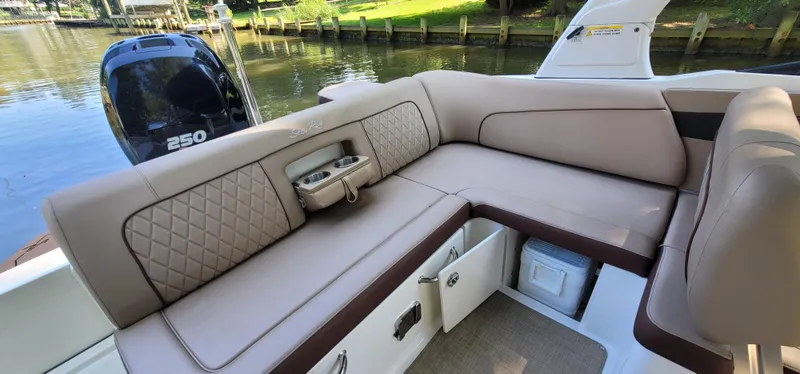 Slide: The Image of Luxurious seating on 2017 Sea Ray SDX 240 Outboard boat, featuring quilted upholstery and storage compartments. - 14
