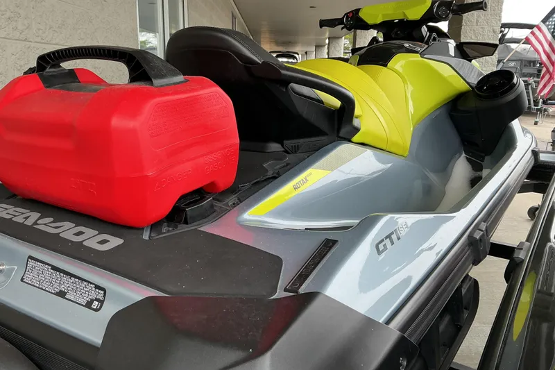 Slide: The Image of 2022 Sea-Doo GTI SE 170 jet ski with red fuel container on deck. - 6