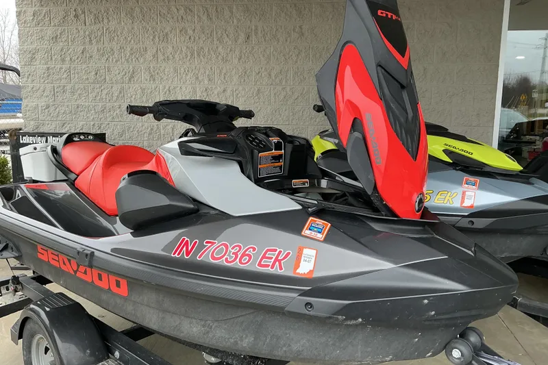 Slide: The Image of 2022 Sea-Doo GTI SE 170 jet ski with red and gray design on a trailer. - 7