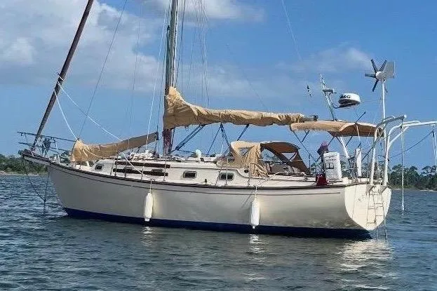 The Image of 1989 Island Packet Cutter sailboat on calm waters. - 0