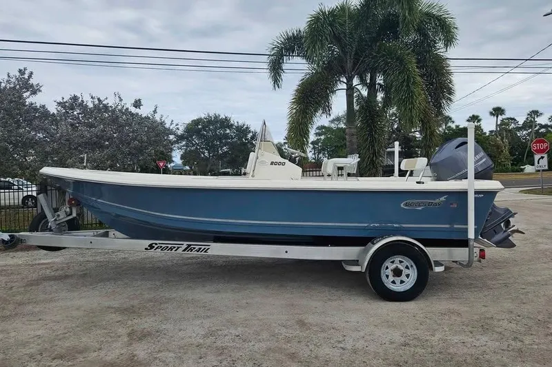 The Image of 2018 Bulls Bay 2000 boat on trailer, parked outdoors near palm trees. - 0