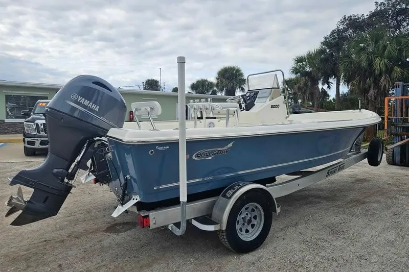 Slide: The Image of 2018 Bulls Bay 2000 boat with Yamaha outboard motor on trailer, parked outdoors. - 3