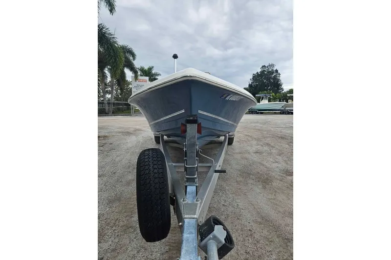 Slide: The Image of 2018 Bulls Bay 2000 boat on trailer, parked outdoors under cloudy sky. - 4
