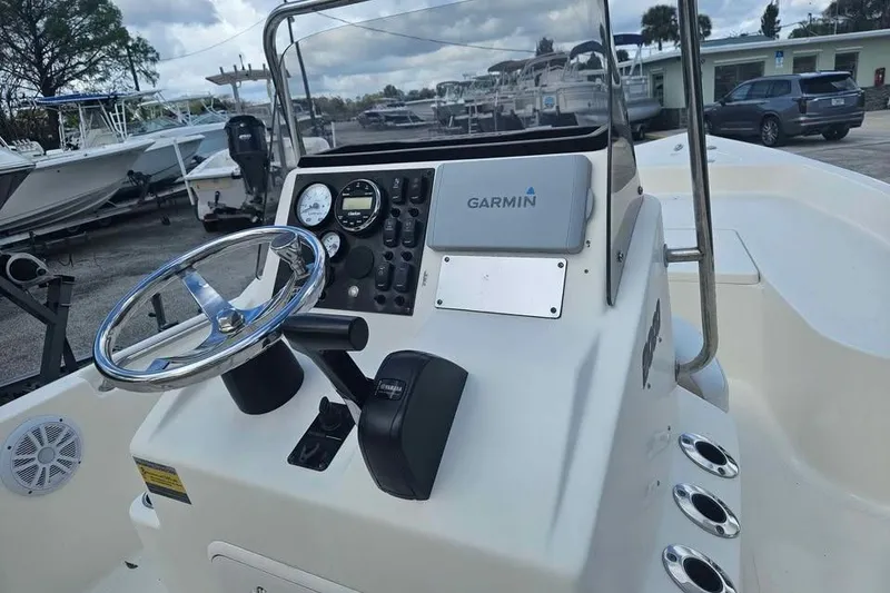 Slide: The Image of 2018 Bulls Bay 2000 boat dashboard with Garmin navigation system and steering wheel. - 6