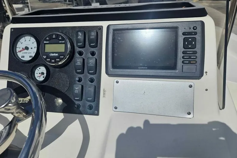 Slide: The Image of Control panel of a 2018 Bulls Bay 2000 boat with gauges and Garmin display. - 7
