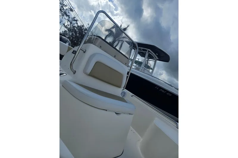 Slide: The Image of 2018 Bulls Bay 2000 boat with seating and windshield, under cloudy sky. - 8