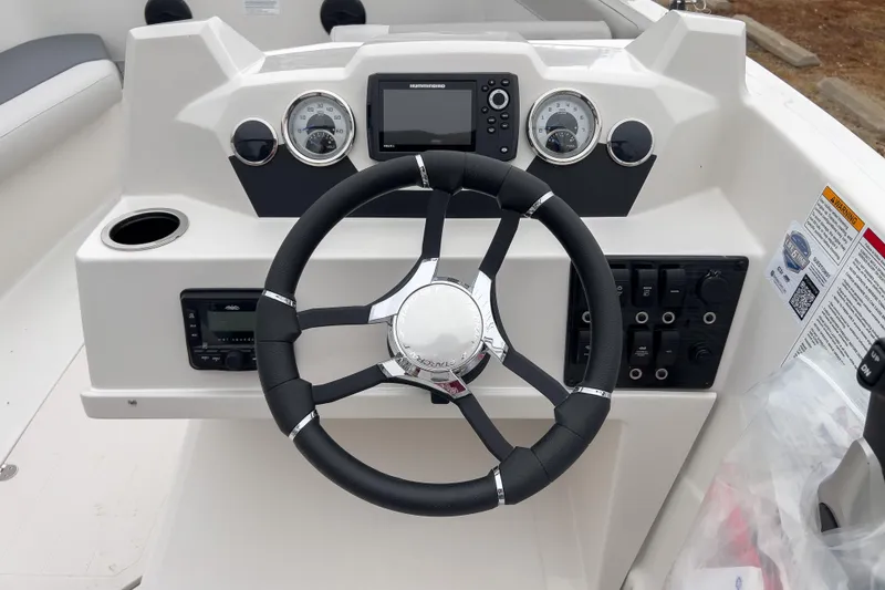 Slide: The Image of Steering console of 2026 Starcraft SVX 171 OB boat with gauges and controls. - 10