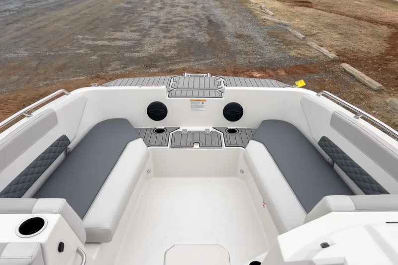 Slide: The Image of 2026 Starcraft SVX 171 OB boat interior with gray seating and cup holders. - 4