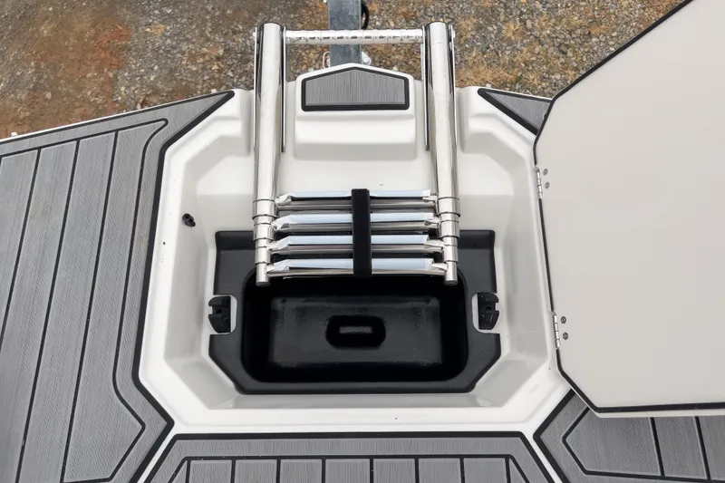 Slide: The Image of 2026 Starcraft SVX 171 OB boat ladder compartment with sleek design and durable materials. - 6