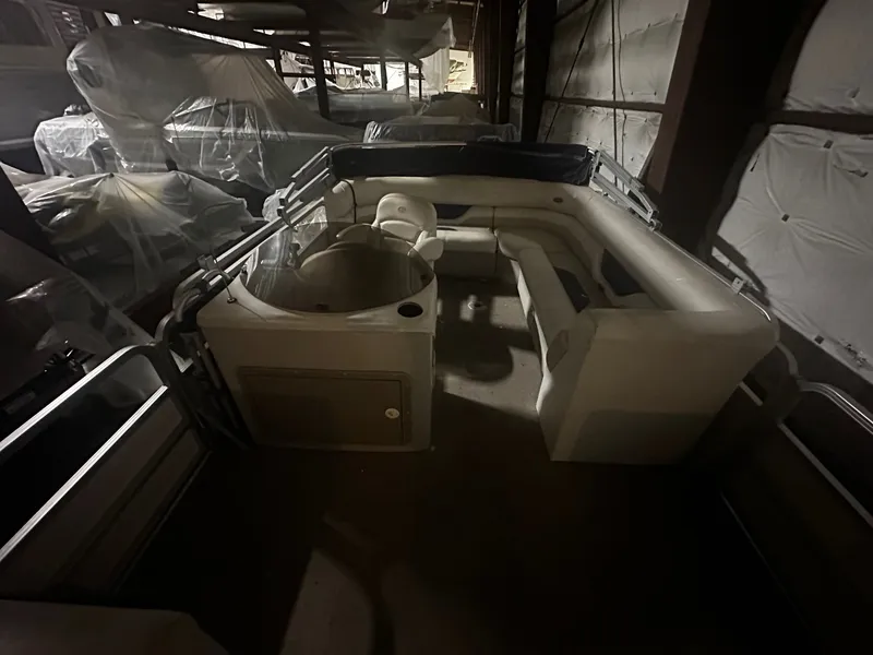 Slide: The Image of 2006 Sylvan 8522 Mirage Cruise RE in warehouse storage. - 4