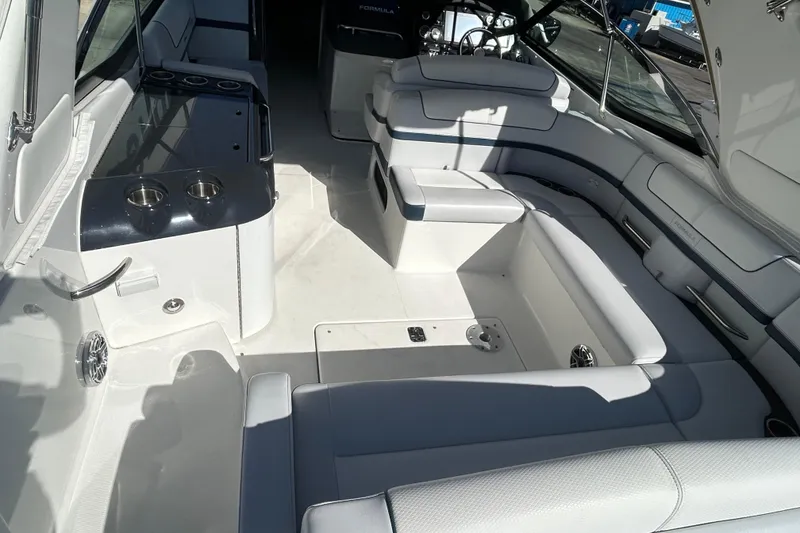 Slide: The Image of 2021 Formula 350 Crossover Bowrider I/O interior with sleek kitchenette and cup holders. - 14